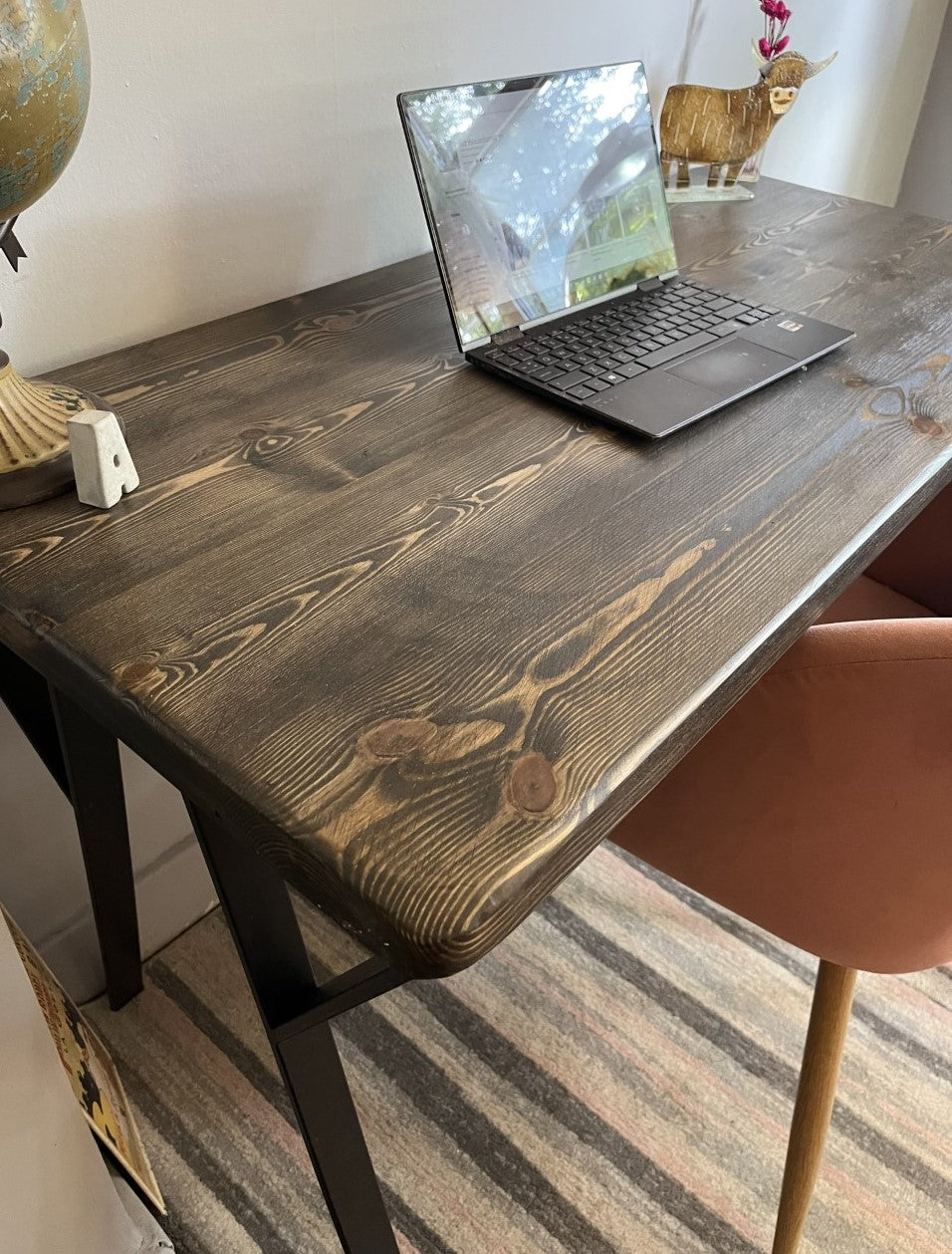 Industrial redwood pine desk with black steel legs and ebony finish, perfect for mid-century modern home office décor