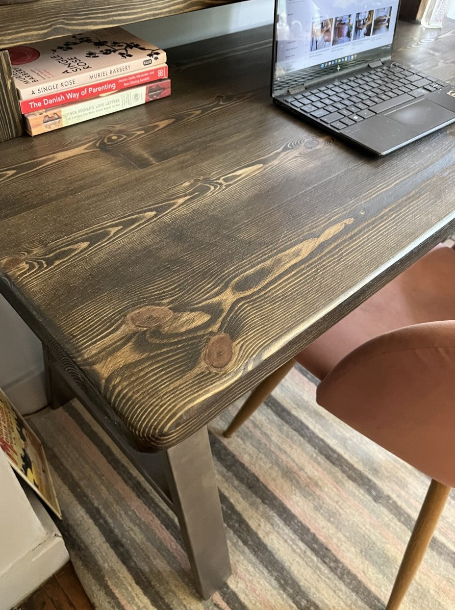 Industrial redwood pine desk with steel A-frame legs and a convenient shelf, perfect for modern home office spaces