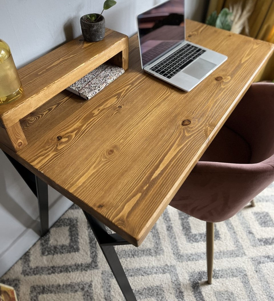 Industrial redwood pine desk with black steel legs, ideal for a mid-century modern home office setup