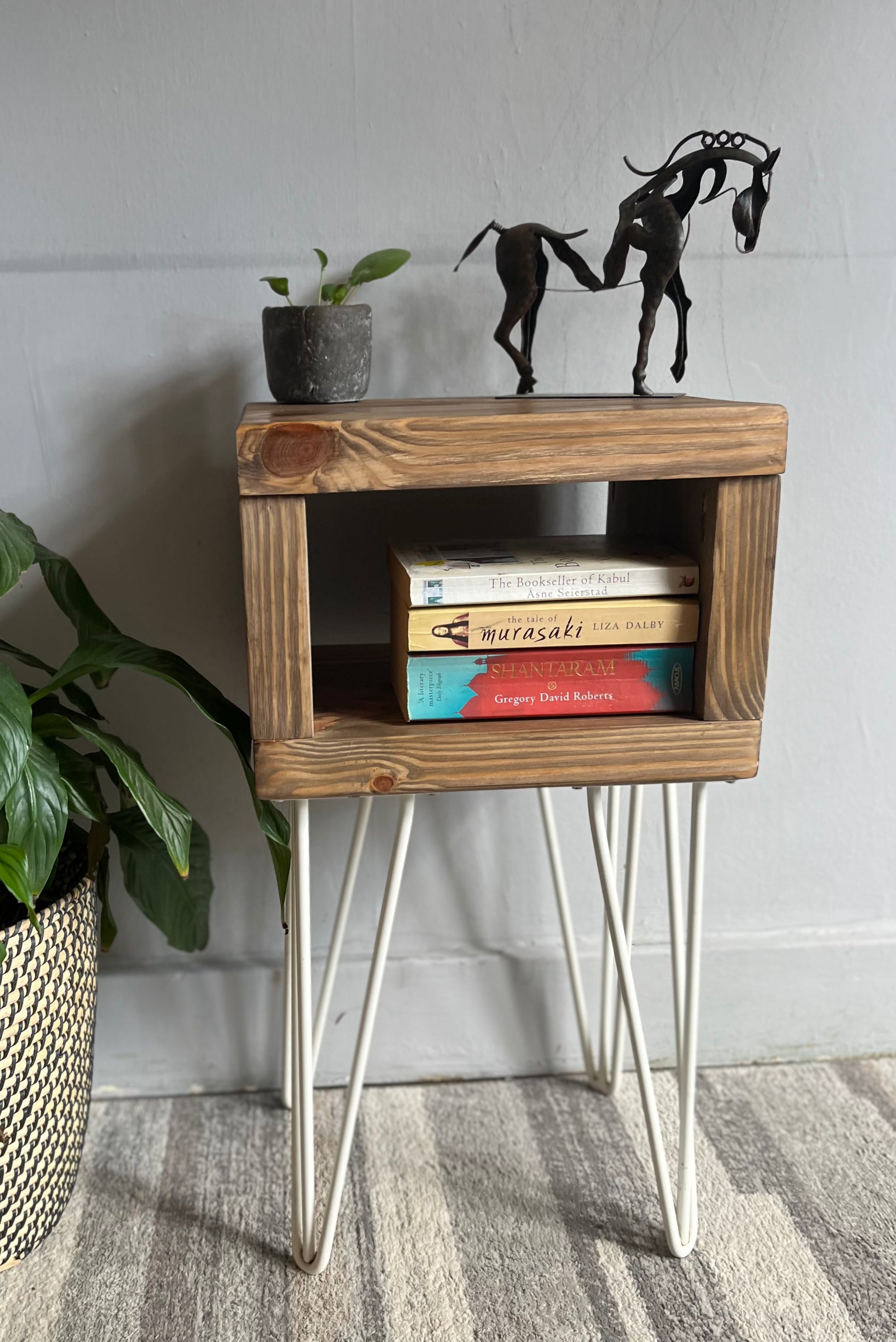 Stylish redwood pine bedside table with white steel hairpin legs, ideal for a mid-century modern bedroom