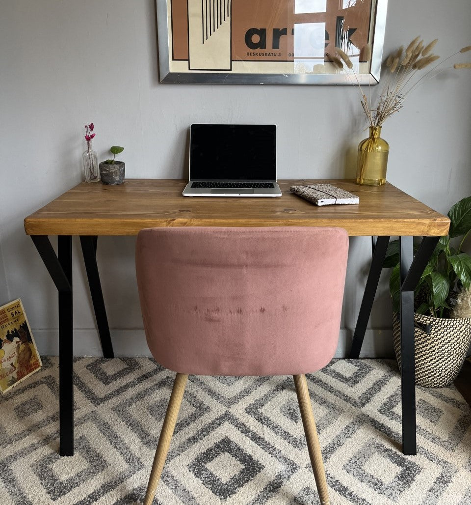 Industrial redwood pine desk with black steel legs, ideal for a mid-century modern home office setup.