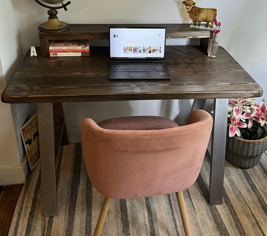 Industrial redwood pine desk with steel A-frame legs and a convenient shelf, perfect for modern home office spaces