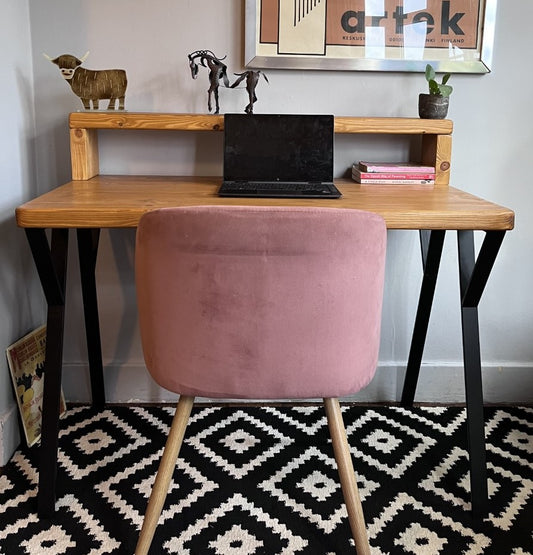 Rustic industrial redwood pine desk with black steel legs, mid shelf, and riser shelf, ideal for a mid-century modern home office