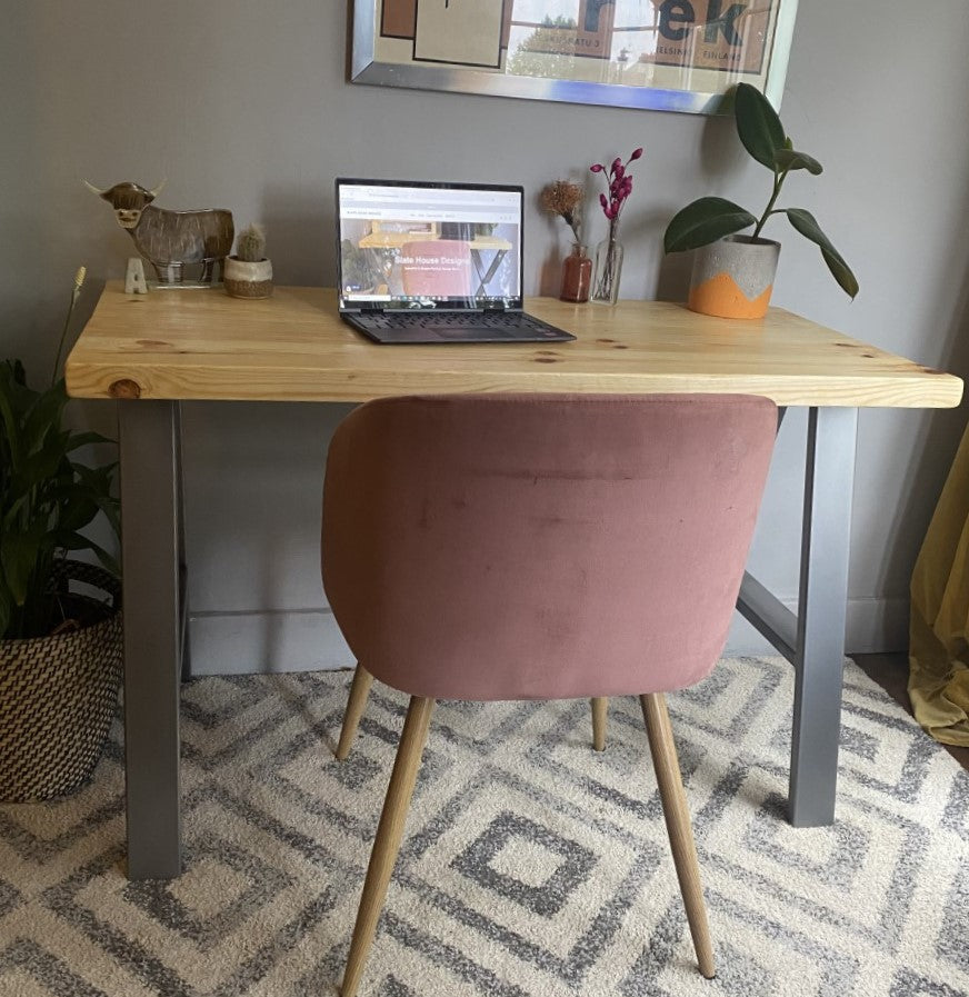 Industrial-style redwood pine desk with steel A-frame legs, perfect for a sleek, modern home office