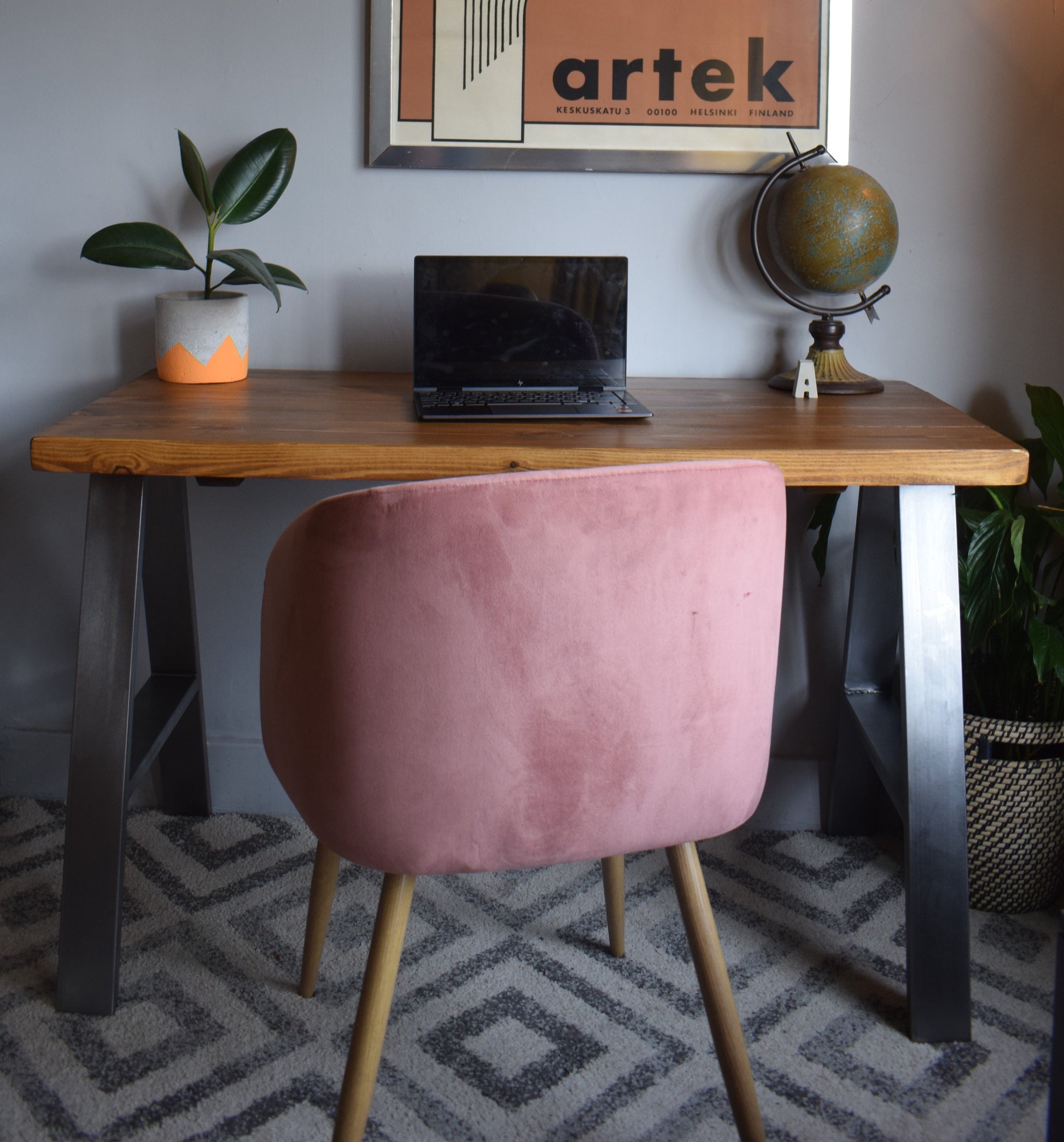 Stylish industrial redwood pine desk with steel A-frame legs, ideal for modern home office setups with a mid-century design