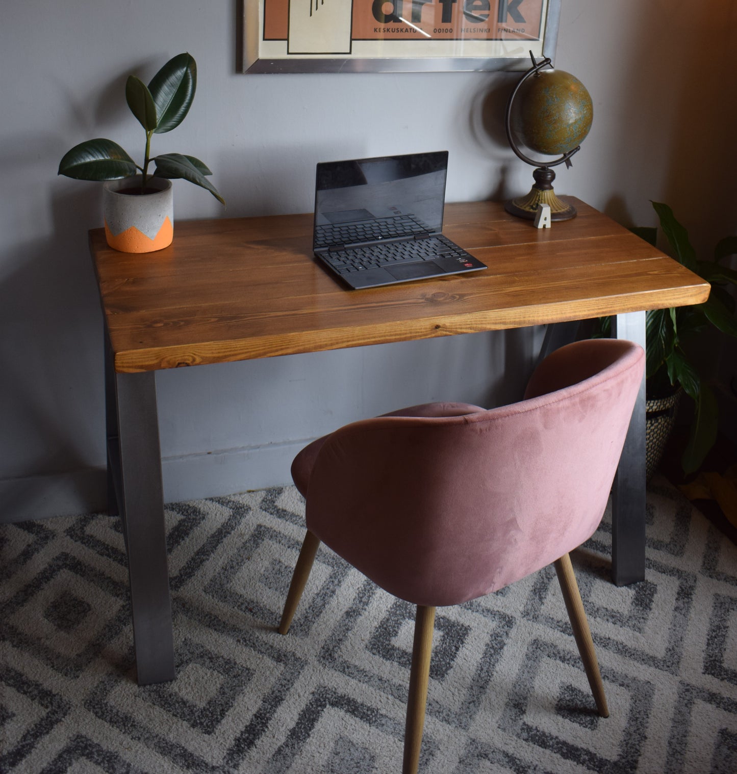 Stylish industrial redwood pine desk with steel A-frame legs, ideal for modern home office setups with a mid-century design