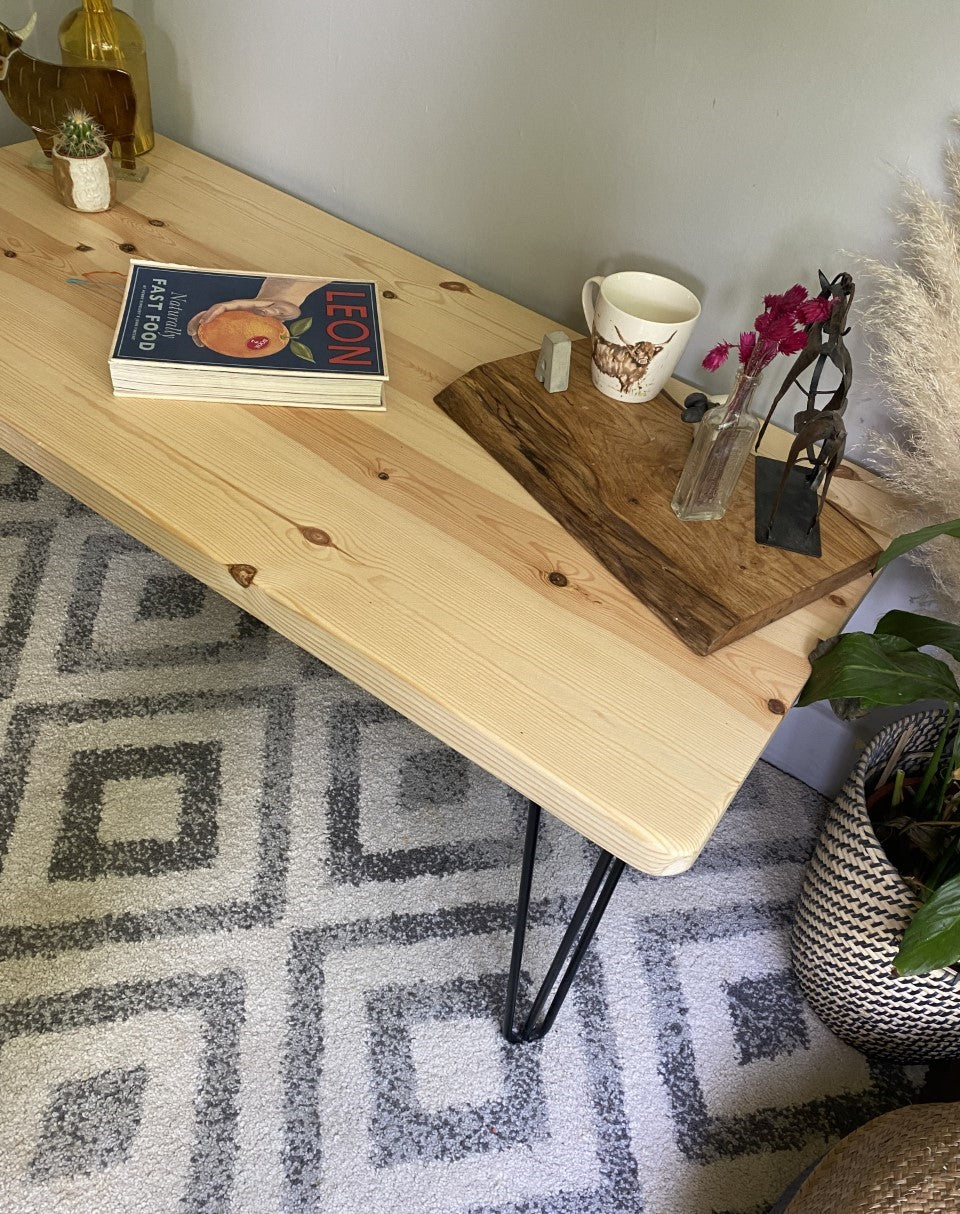 Elegant redwood pine coffee table with black steel hairpin legs, bringing a mid-century modern touch to your living room décor.