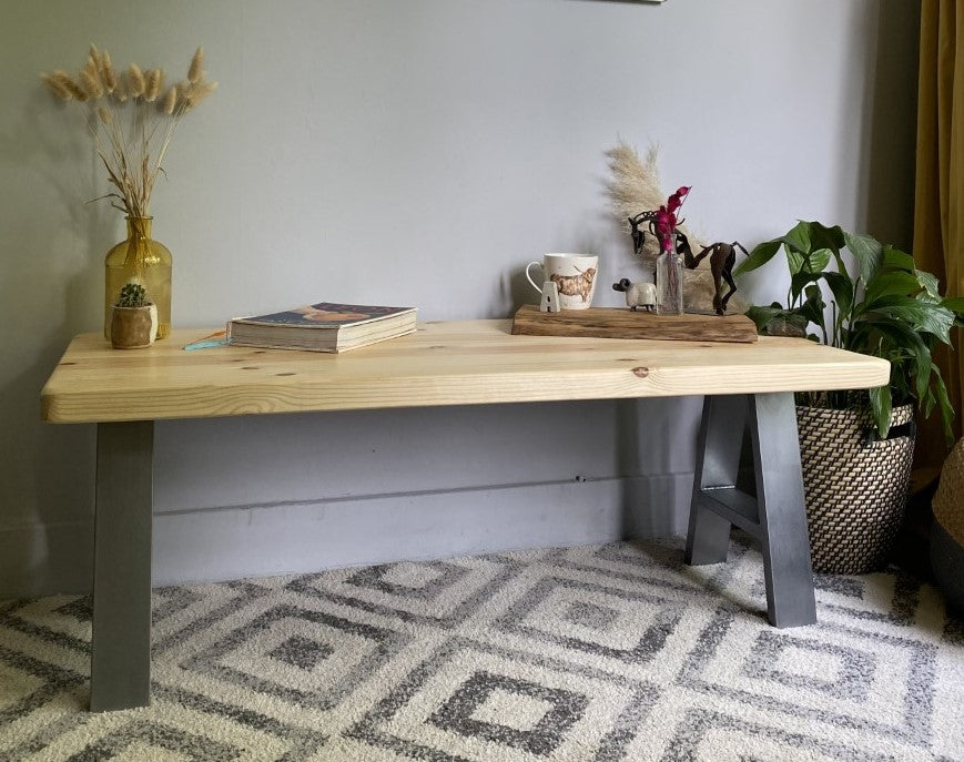 Stylish redwood pine coffee table with steel frame legs, designed to add a bold mid-century modern touch to your living room