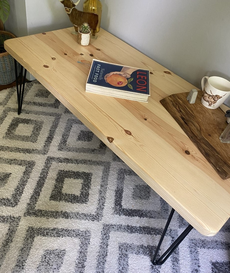 Elegant redwood pine coffee table with black steel hairpin legs, bringing a mid-century modern touch to your living room décor.