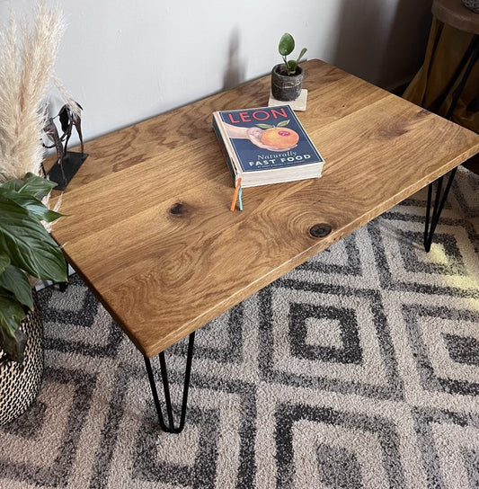 Stylish oak coffee table with sleek black steel hairpin legs, perfect for modern and mid-century inspired living rooms