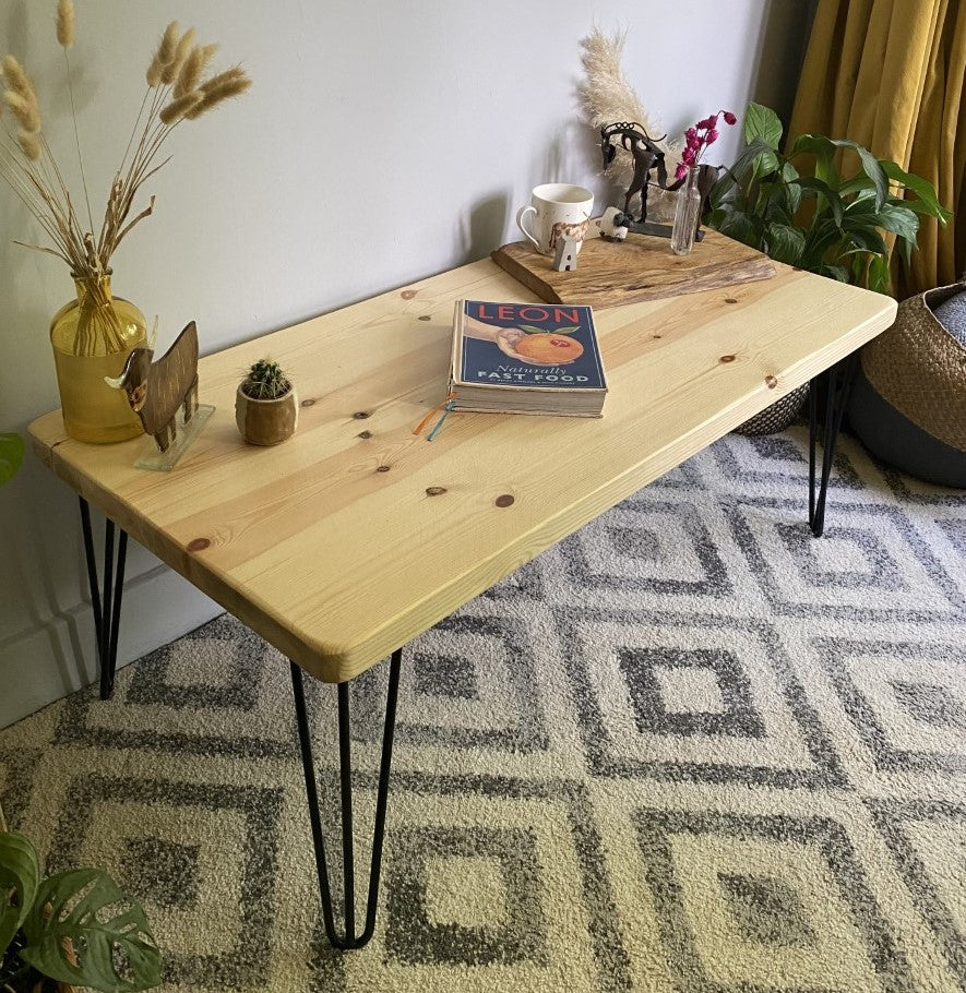 Elegant redwood pine coffee table with black steel hairpin legs, bringing a mid-century modern touch to your living room décor.