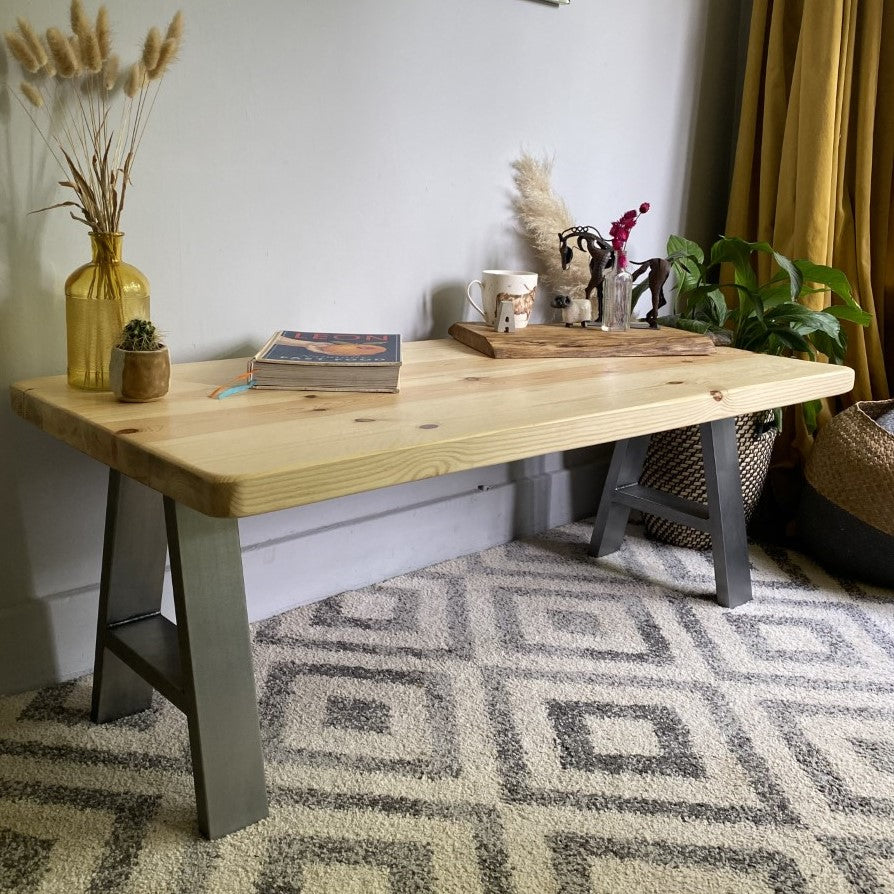 Stylish redwood pine coffee table with steel frame legs, designed to add a bold mid-century modern touch to your living room