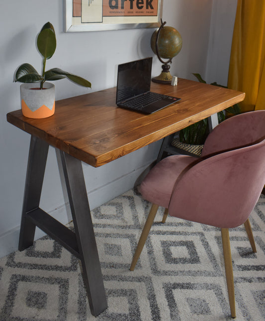 Stylish industrial redwood pine desk with steel A-frame legs, ideal for modern home office setups with a mid-century design