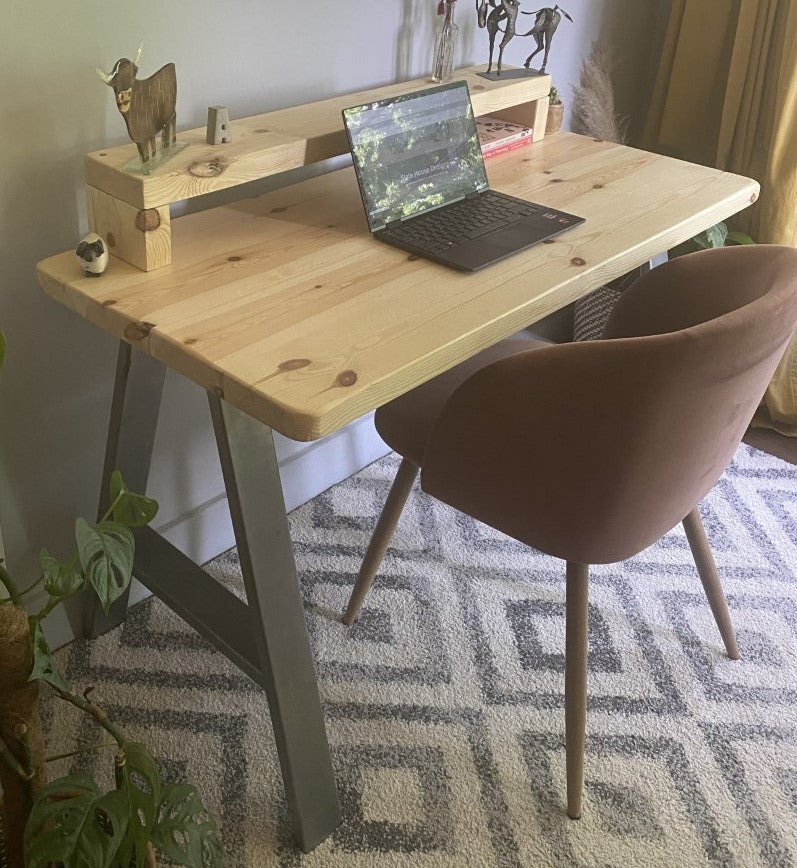 Redwood pine desk with steel A-frame legs and a mid shelf, combining industrial style with practical storage for home offices