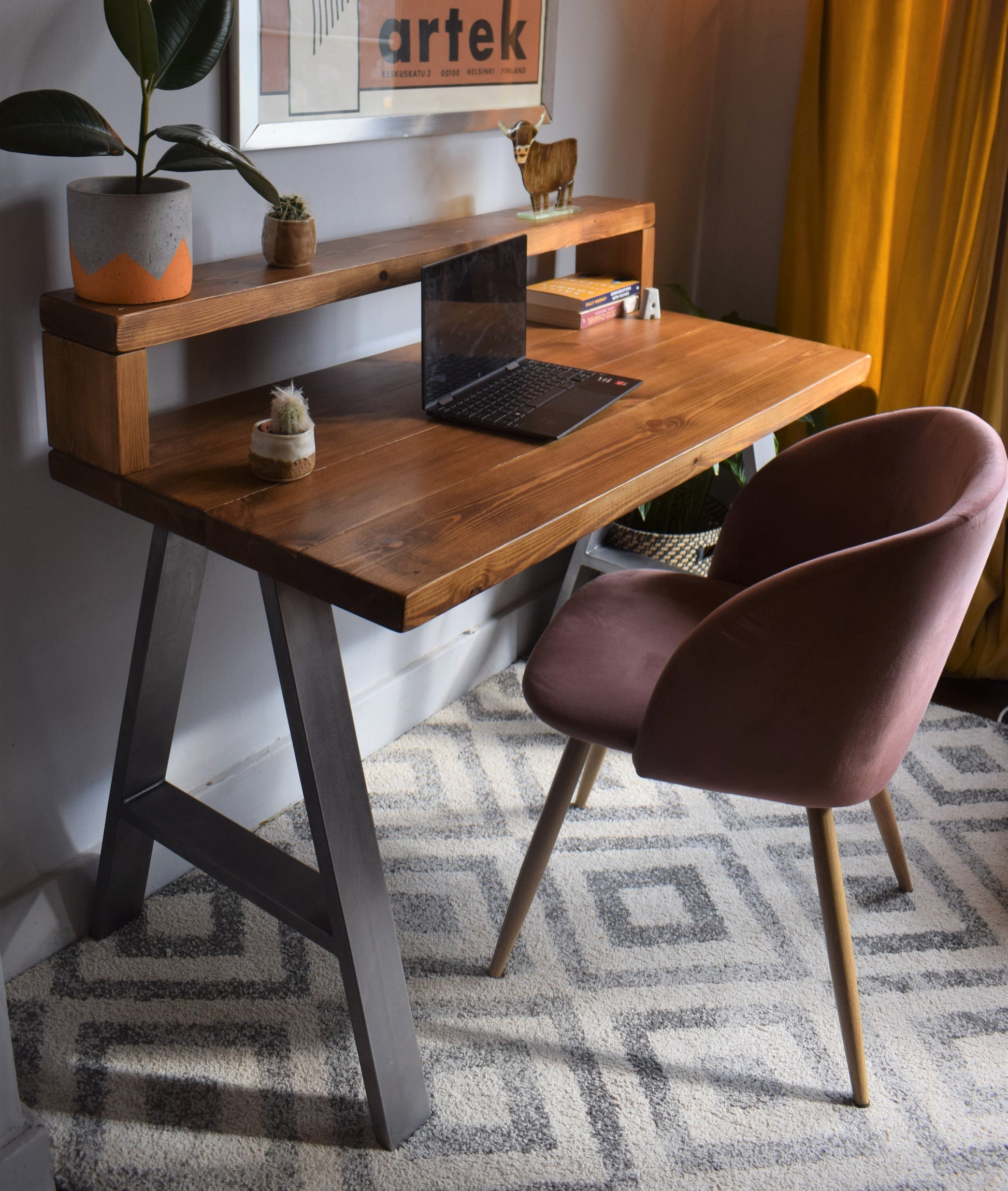 Industrial redwood pine desk with steel A-frame legs and shelf, combining modern design with practical storage for home offices