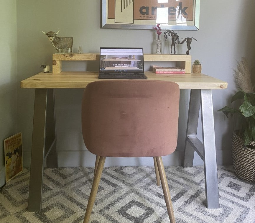 Redwood pine desk with steel A-frame legs and a mid shelf, combining industrial style with practical storage for home offices