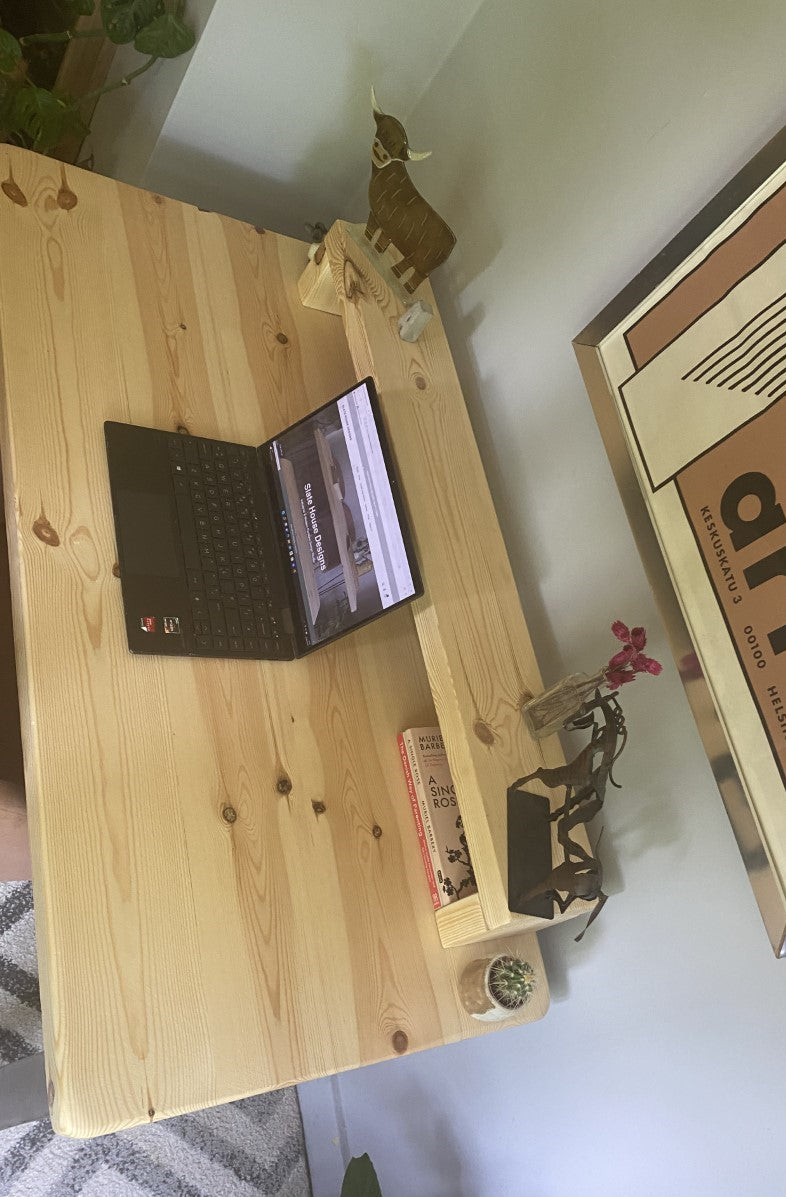 Redwood pine desk with steel A-frame legs and a mid shelf, combining industrial style with practical storage for home offices