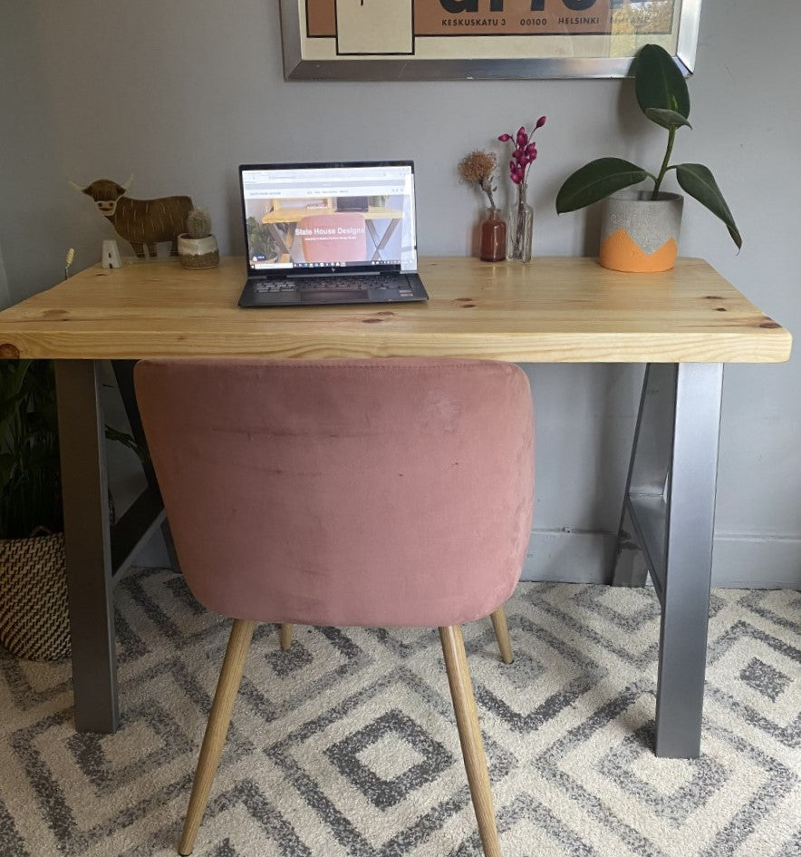 Industrial-style redwood pine desk with steel A-frame legs, perfect for a sleek, modern home office