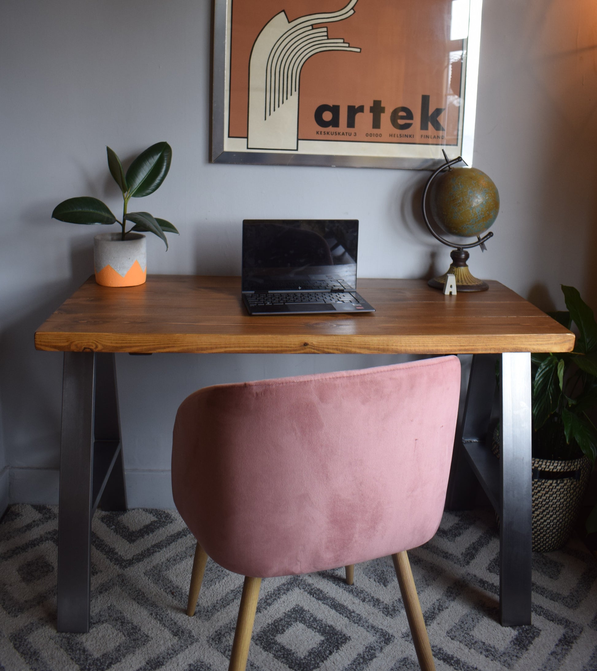 Stylish industrial redwood pine desk with steel A-frame legs, ideal for modern home office setups with a mid-century design