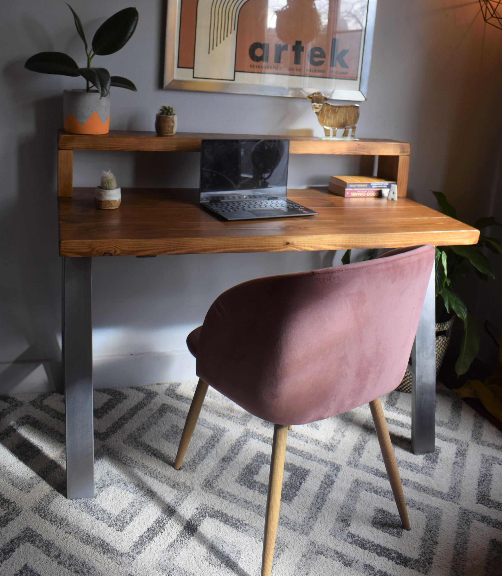 Industrial redwood pine desk with steel A-frame legs and shelf, combining modern design with practical storage for home offices