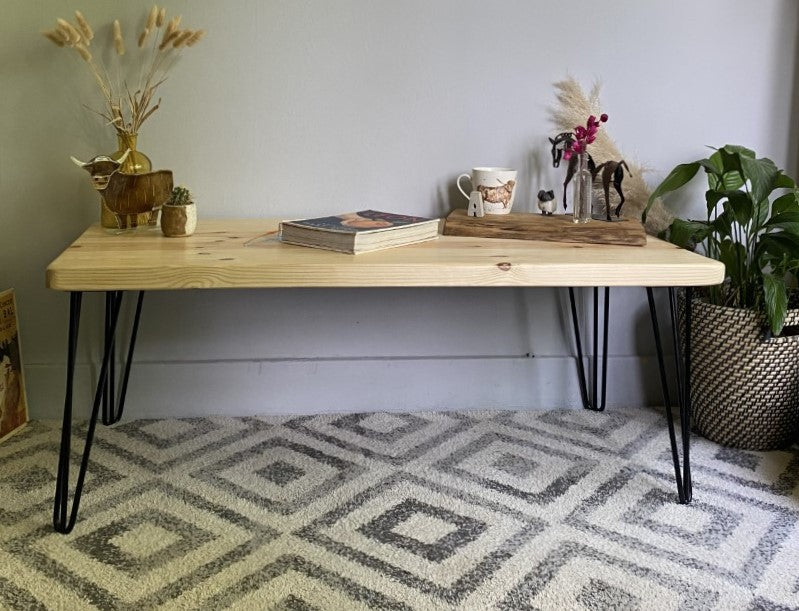 Elegant redwood pine coffee table with black steel hairpin legs, bringing a mid-century modern touch to your living room décor.