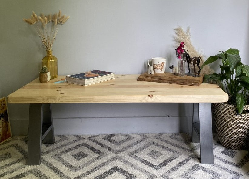 Stylish redwood pine coffee table with steel frame legs, designed to add a bold mid-century modern touch to your living room