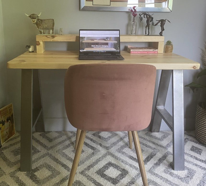 Redwood pine desk with steel A-frame legs and a mid shelf, combining industrial style with practical storage for home offices