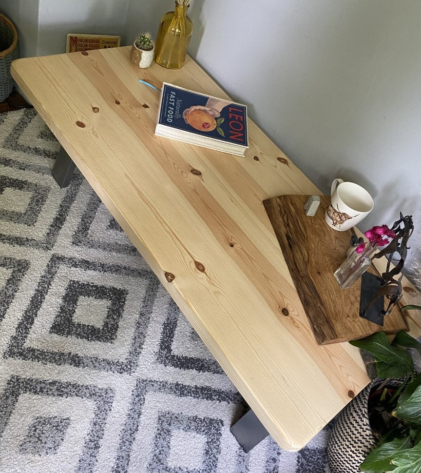 Stylish redwood pine coffee table with steel frame legs, designed to add a bold mid-century modern touch to your living room