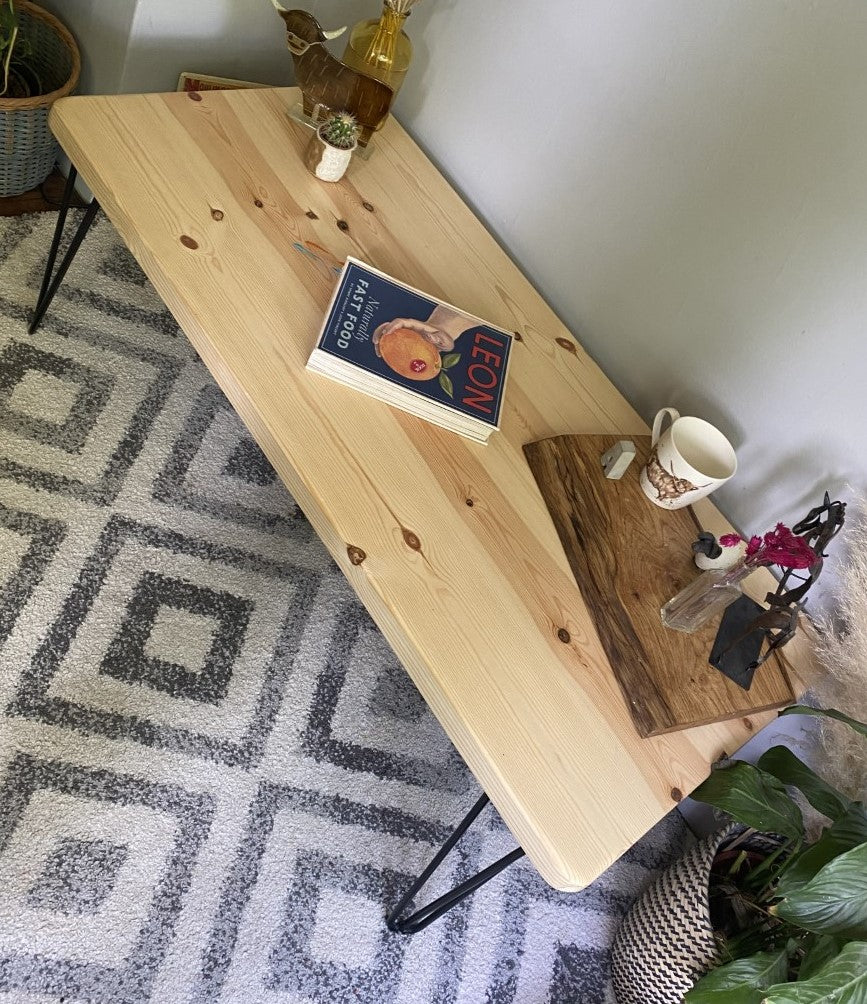 Elegant redwood pine coffee table with black steel hairpin legs, bringing a mid-century modern touch to your living room décor.