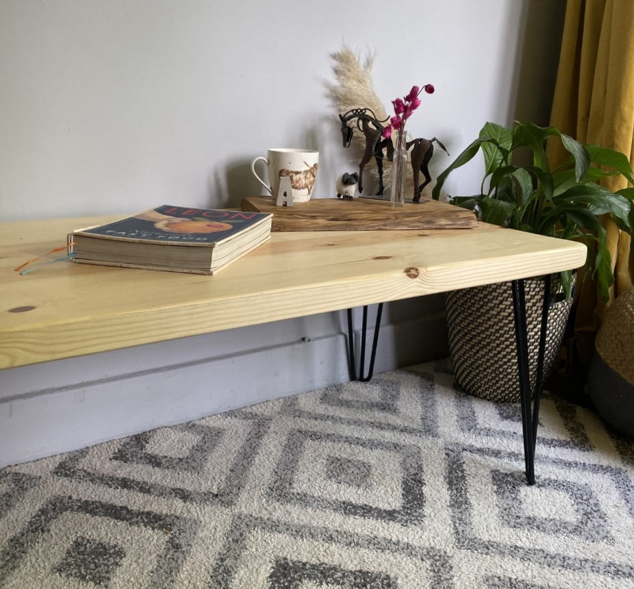 Elegant redwood pine coffee table with black steel hairpin legs, bringing a mid-century modern touch to your living room décor.