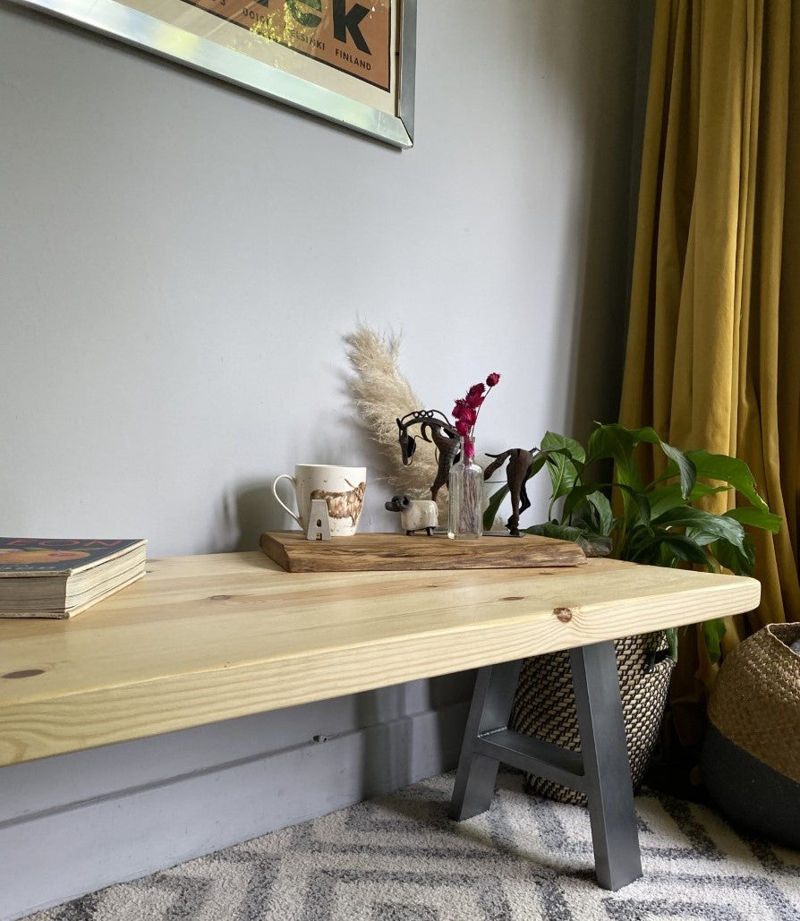 Stylish redwood pine coffee table with steel frame legs, designed to add a bold mid-century modern touch to your living room