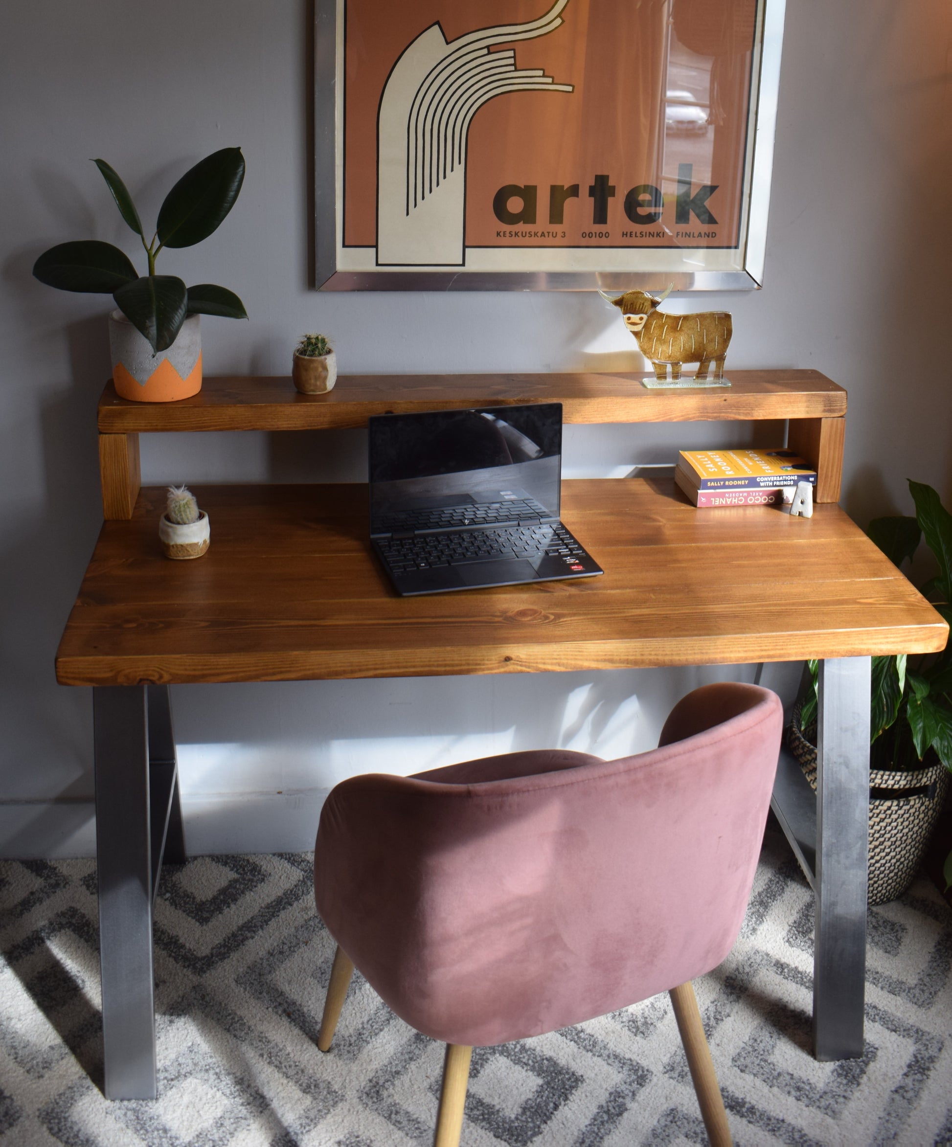 Industrial redwood pine desk with steel A-frame legs and shelf, combining modern design with practical storage for home offices