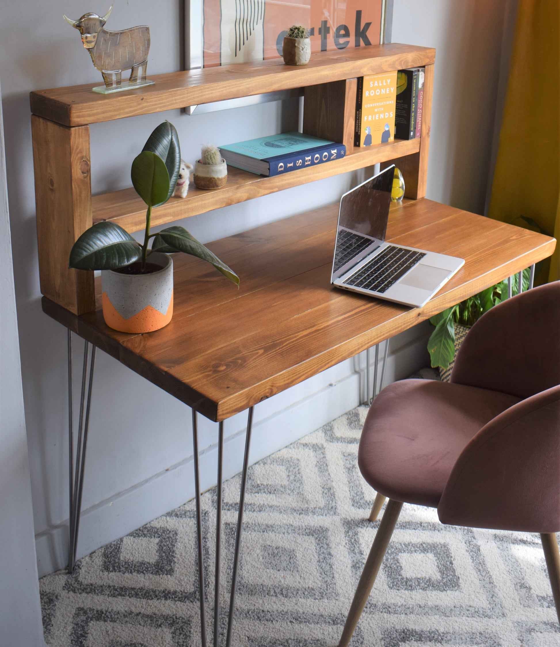 Industrial redwood pine desk with tall shelf and raw steel hairpin legs for modern design.