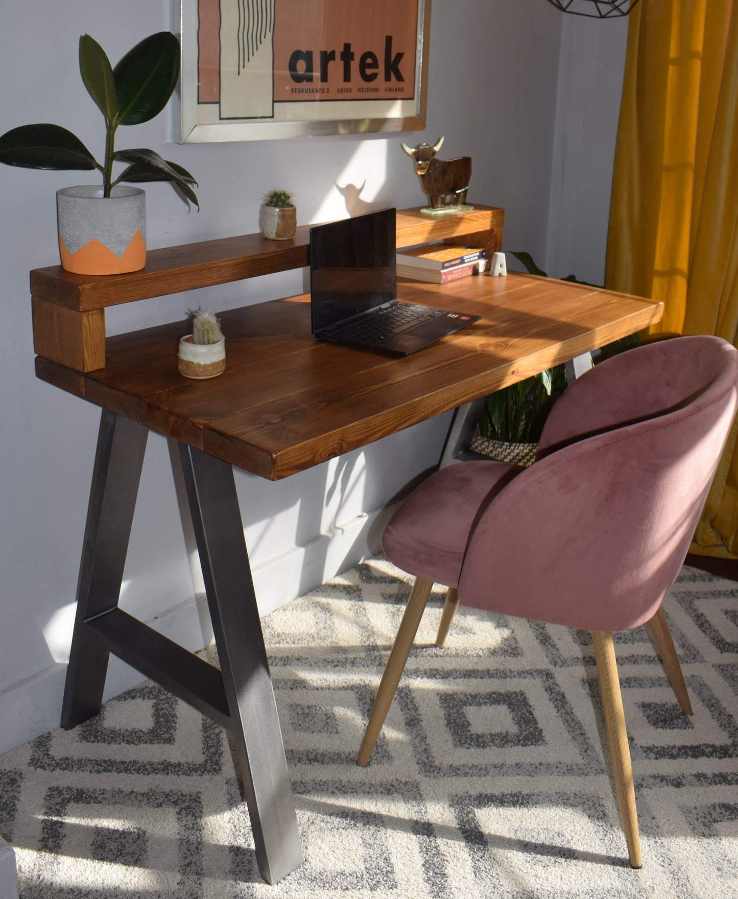 Industrial redwood pine desk with steel A-frame legs and shelf, combining modern design with practical storage for home offices