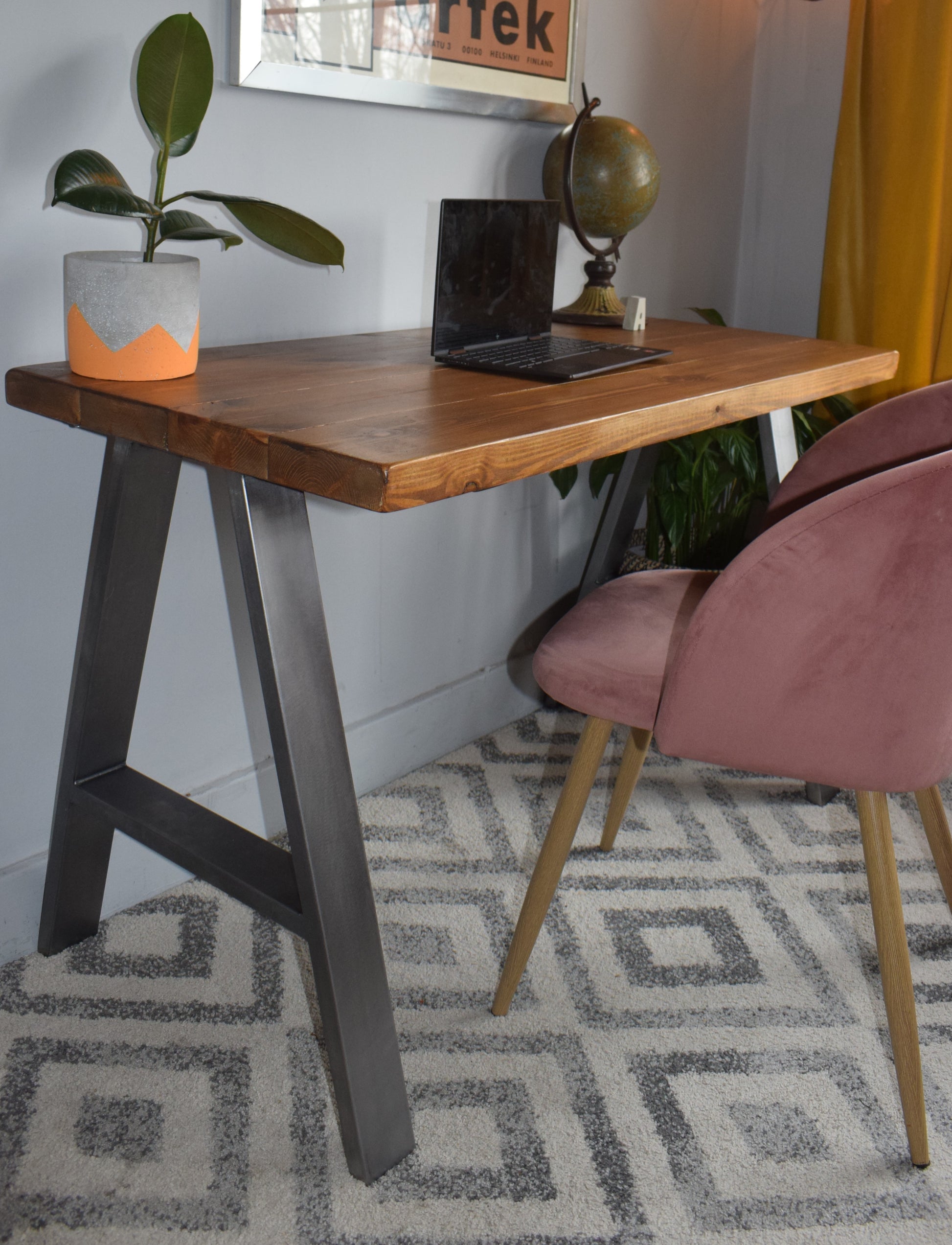 Stylish industrial redwood pine desk with steel A-frame legs, ideal for modern home office setups with a mid-century design