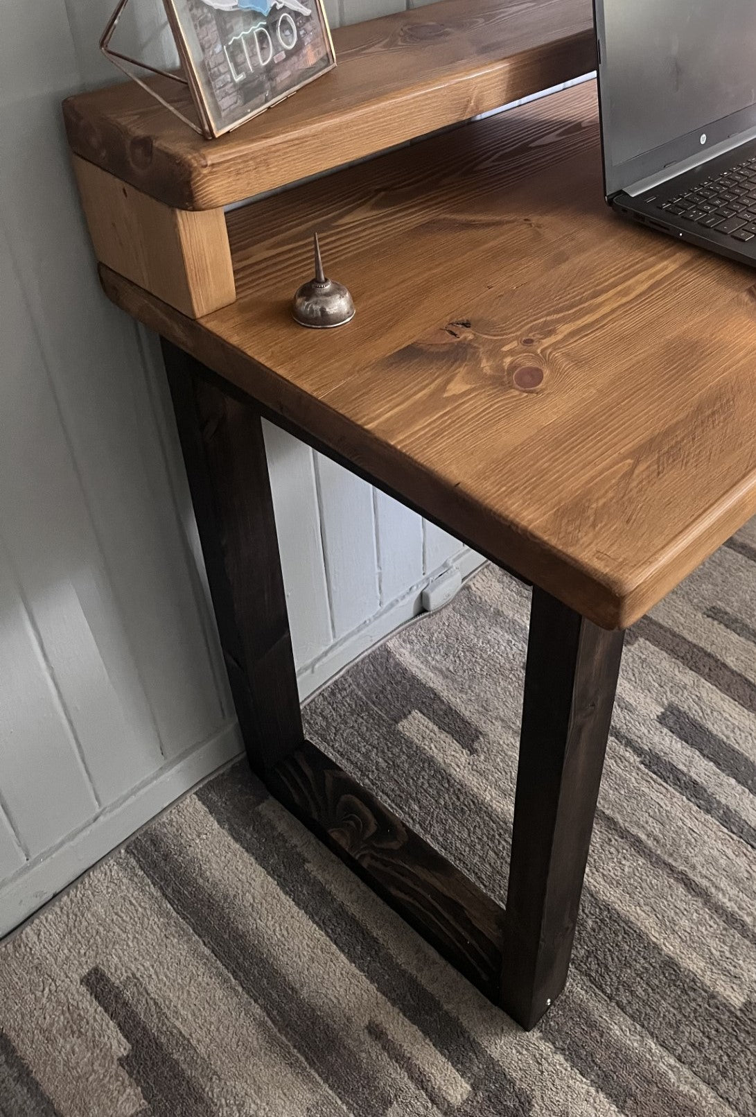 Industrial redwood pine desk with black wood frame legs and shelf for home office, mid-century modern style