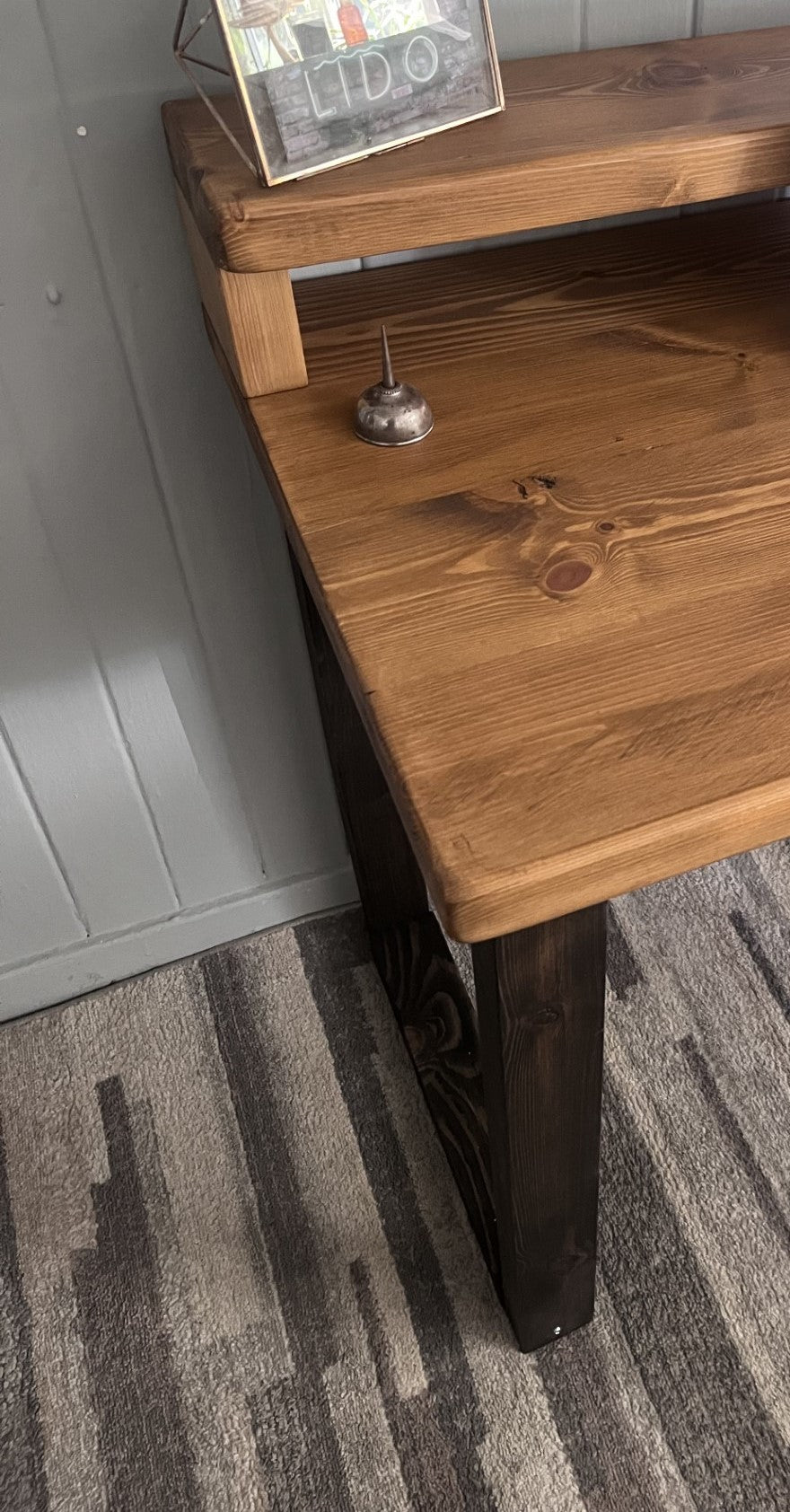 Industrial redwood pine desk with black wood frame legs and shelf for home office, mid-century modern style