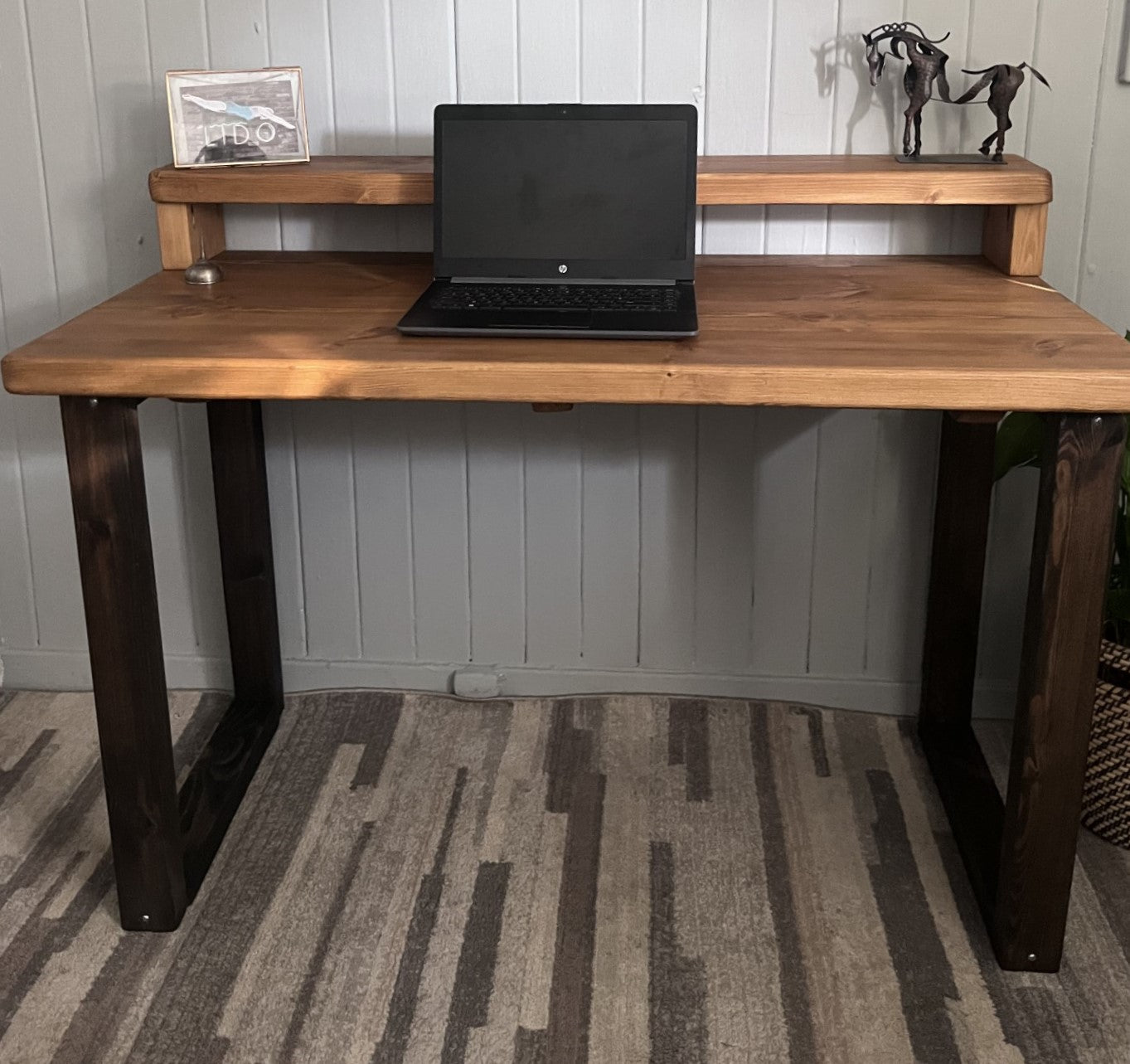 Industrial redwood pine desk with black wood frame legs and shelf for home office, mid-century modern style