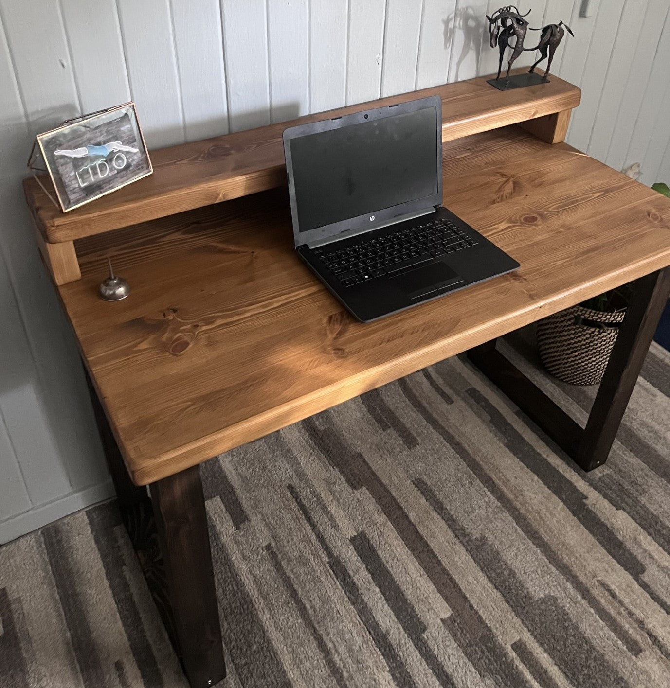 Industrial redwood pine desk with black wood frame legs and shelf for home office, mid-century modern style