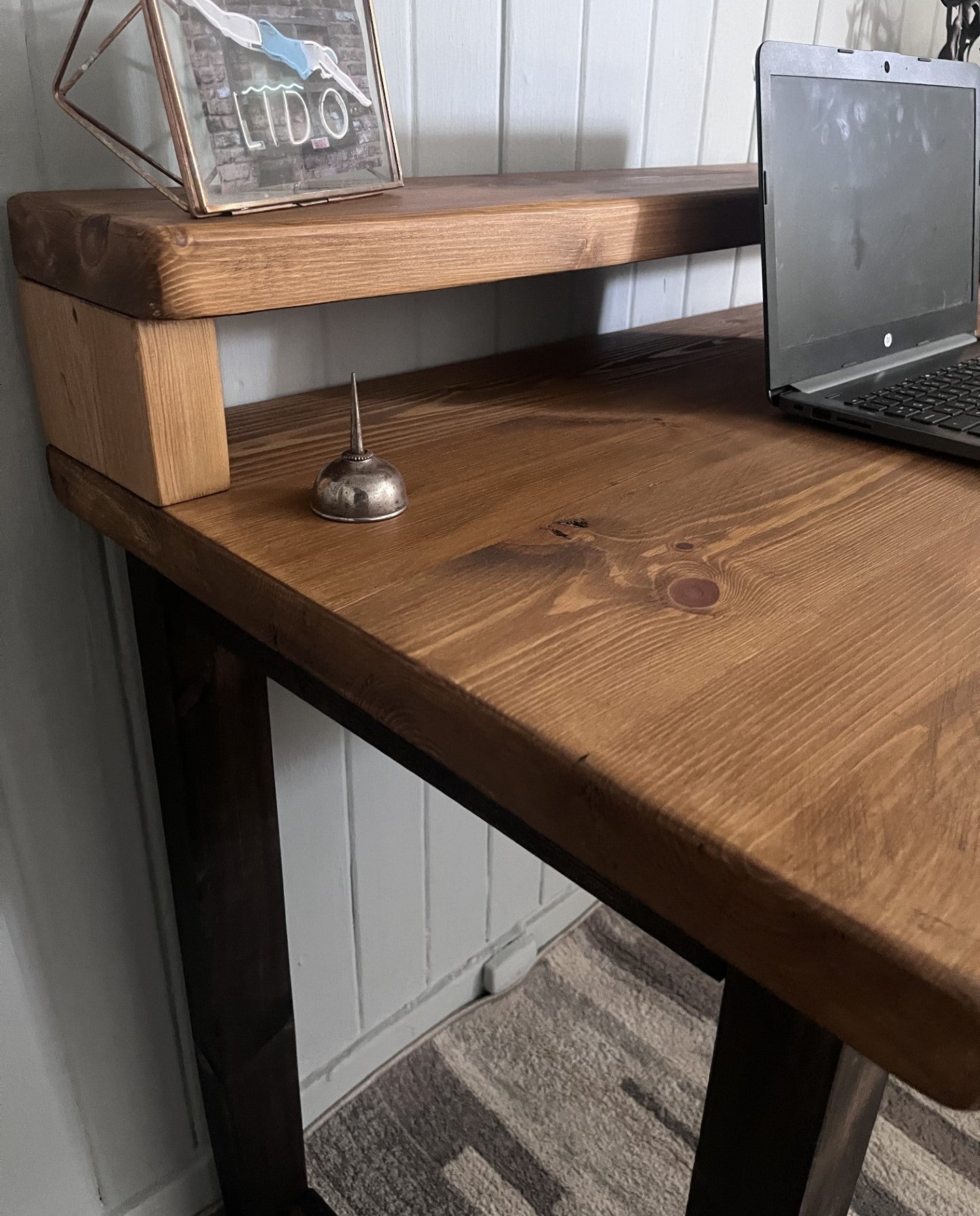 Industrial redwood pine desk with black wood frame legs and shelf for home office, mid-century modern style