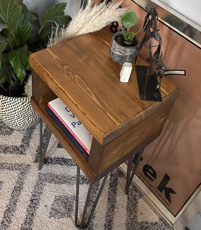 Elegant redwood pine bedside table with raw steel hairpin legs, perfect for a mid-century modern bedroom look