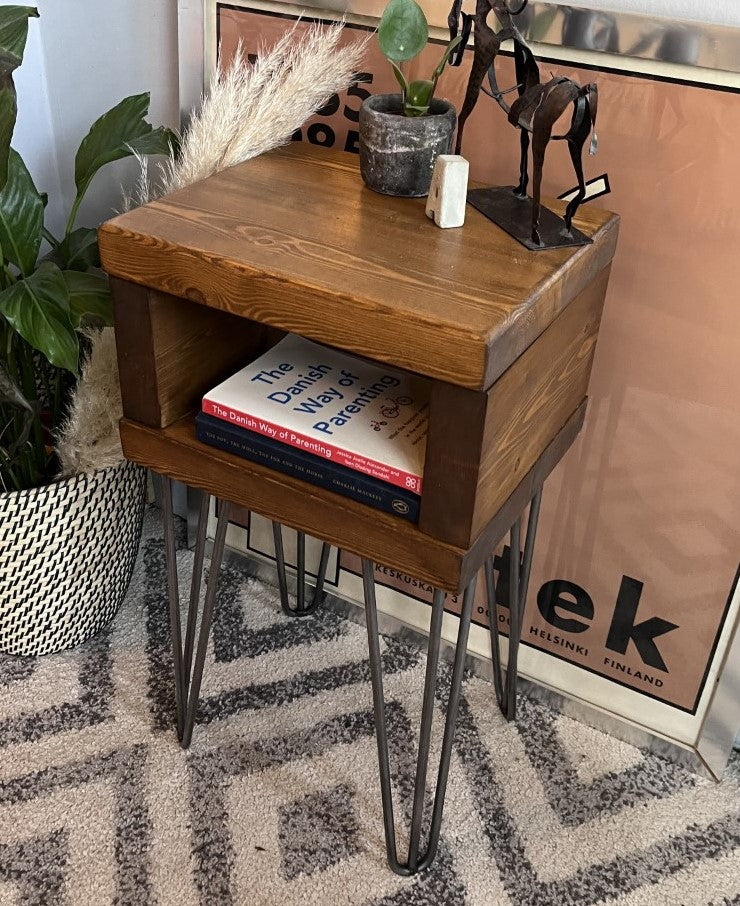 Elegant redwood pine bedside table with raw steel hairpin legs, perfect for a mid-century modern bedroom look