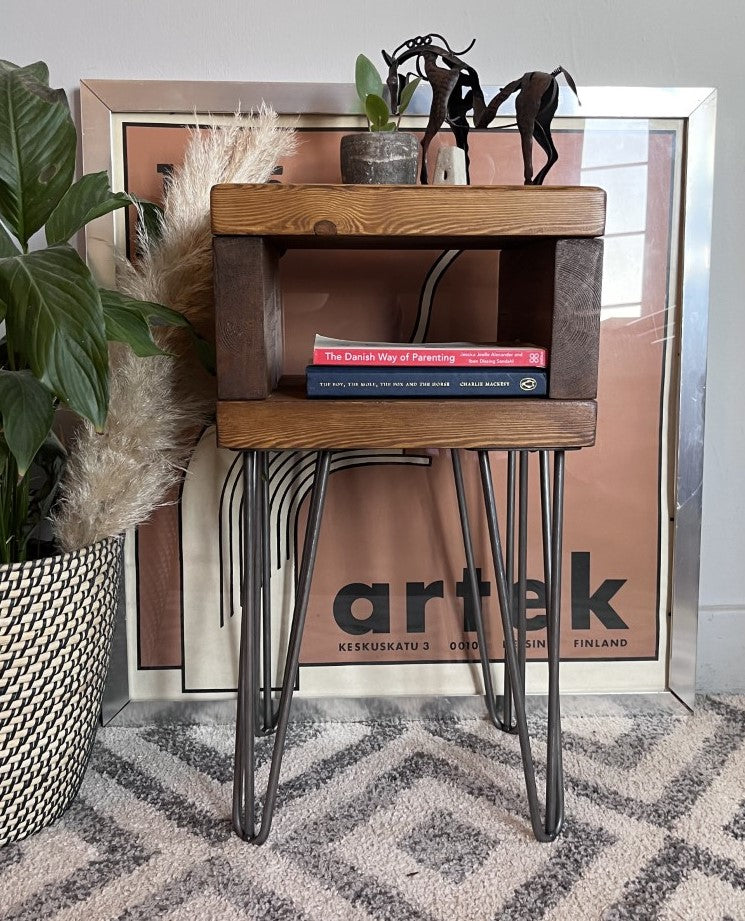 Elegant redwood pine bedside table with raw steel hairpin legs, perfect for a mid-century modern bedroom look